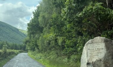 Winding along the scenic Glenmalure road, a place steeped in Ireland's fight for freedom, stands the stark and poignant Dwyer's Rock.
